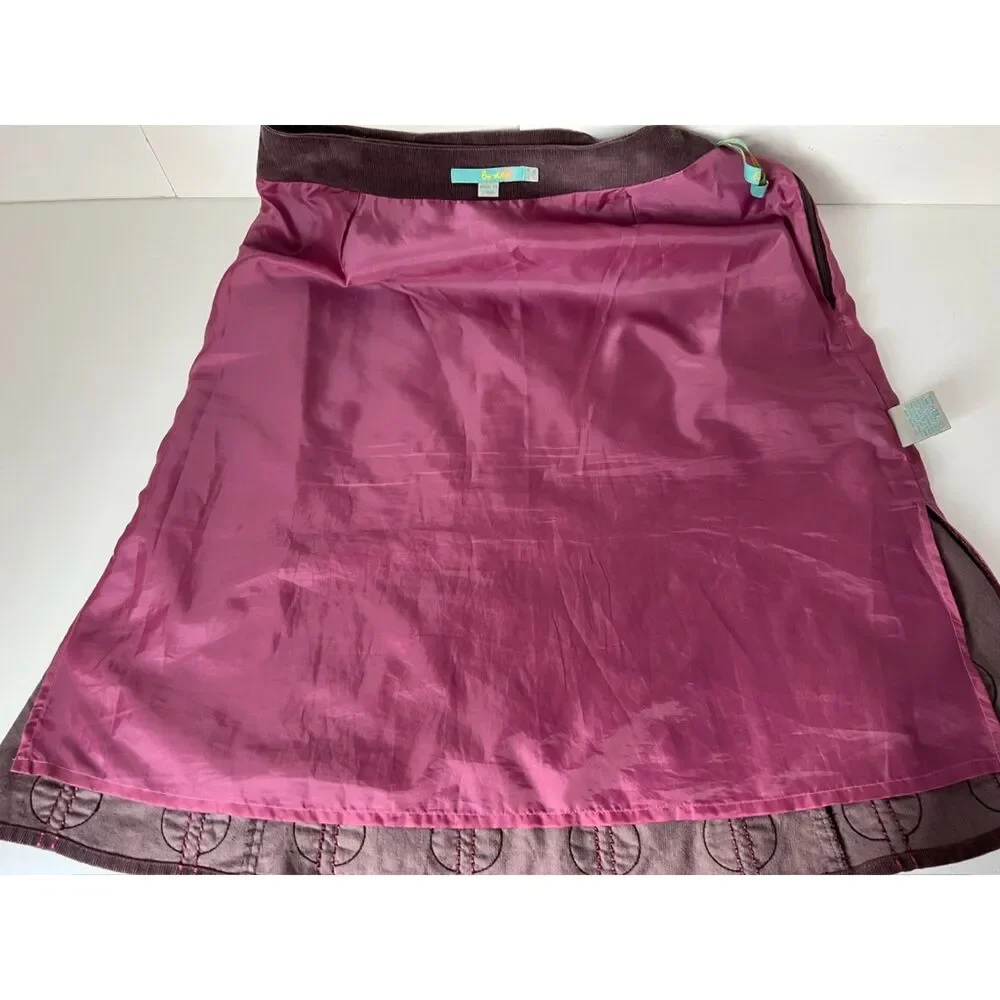 Boden dark brown corduroy a-line skirt with applique circles. Size 8.